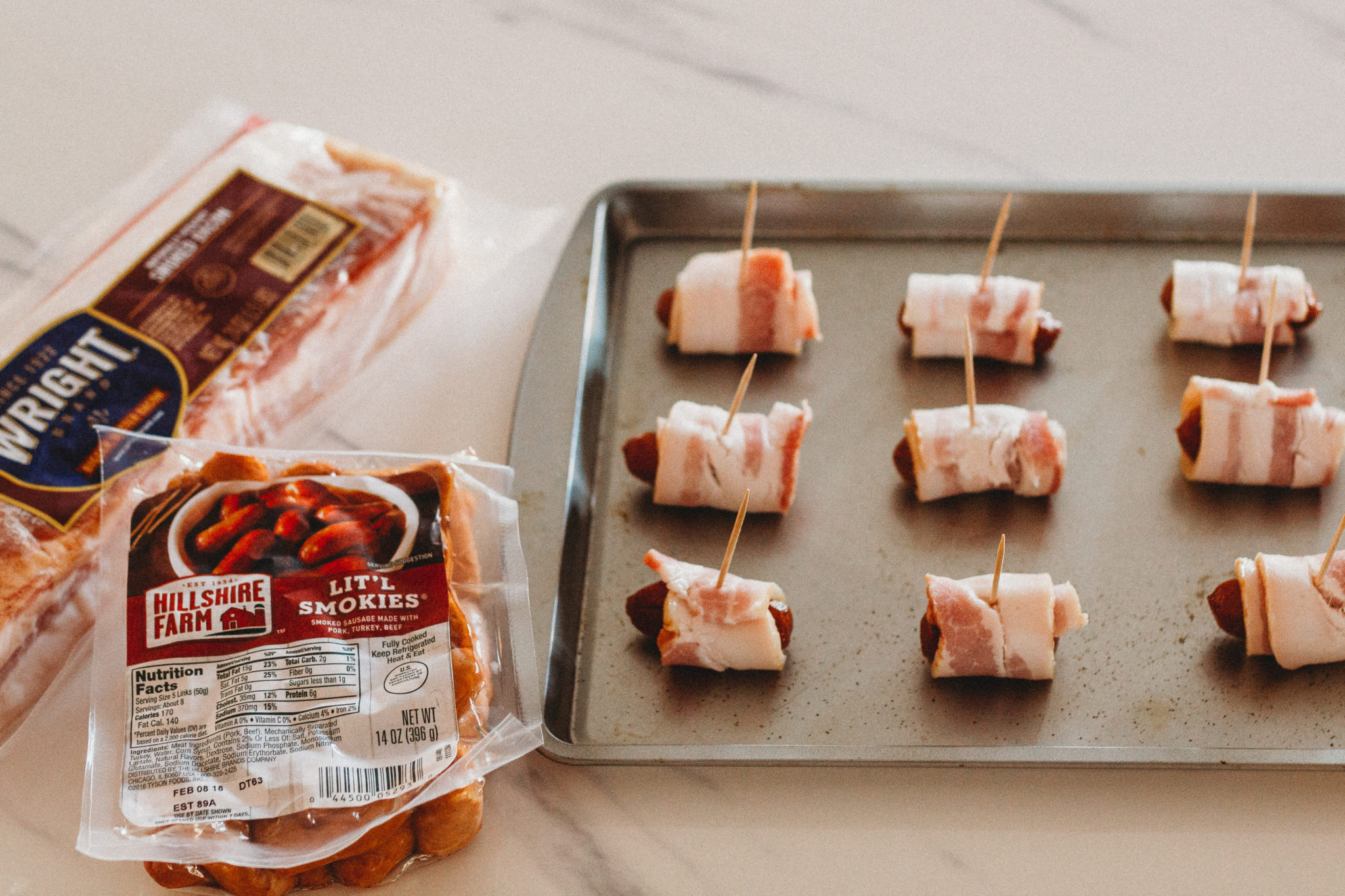 Celebrate the Big Game with quick and easy appetizers like this fun take on the jalapeno popper using Litl Smokies sausages wrapped in bacon and topped with cheddar cheese and jalapeno. #ad #TysonWinningLineup #Walmart