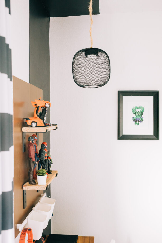 #boysbedroom #superherobedroom #modernsuperhero #colorblock A modern boho color block wall in our son's superhero themed bedroom includes floating wall shelves, a puck light hack within a pendent light and other fun elements.